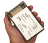 The MIL-F-6218 Survival Fishing Kit comes in a plastic container that fits in the palm of your hand and holds more than 30 pieces of fishing tackle and related survival components.