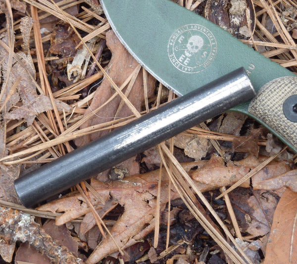 A ferro rod with knife for striking.
