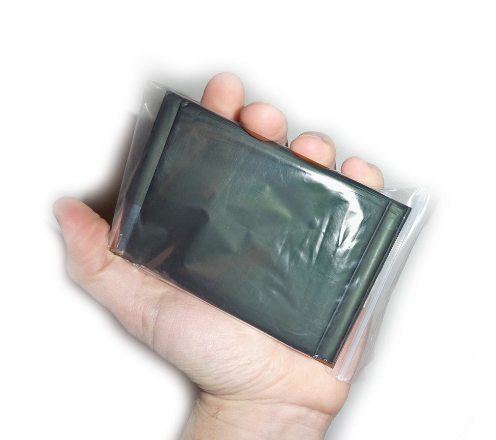 When folded this olive drab emergency space blanket fits in the palm of your hand.