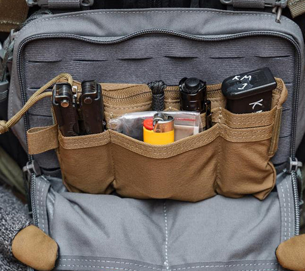 Coyote Brown Hill People Gear 58 Pouch in use, holding survival and shooting gear.