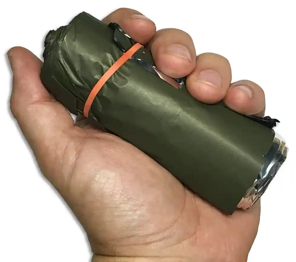 This American-made olive drab emergency blanket fits in the palm of your hand and is designed to protect against hypothermia, hyperthermia, and shock.